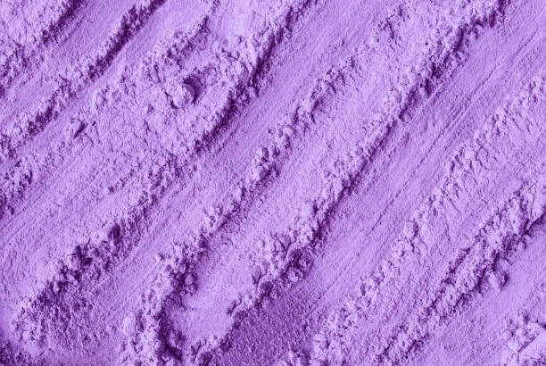 istock Purple clay powder (alginate face mask, body wrap, hair shampoo, conditioner) texture close-up, selective focus. Abstract lavender background with brush strokes. 1443805418