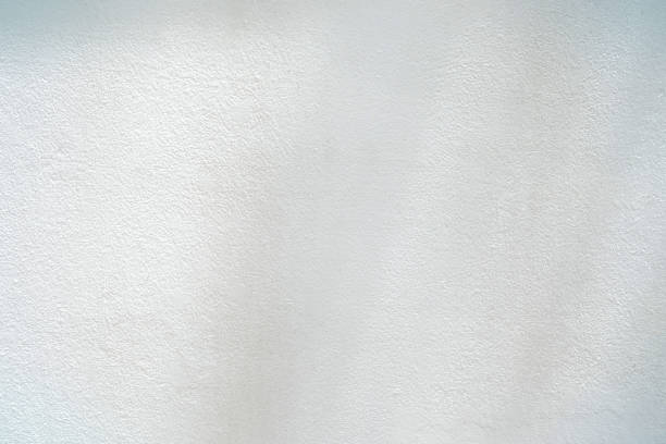White Painting on Concrete Wall Texture Background with Sunlight on the Surface.