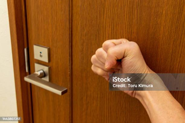 Knock On The Door With A Hand Stock Photo - Download Image Now - Toilet, Door, Entering