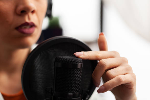istock Close up of vlogger tapping microphone before make youtube video 1443807899