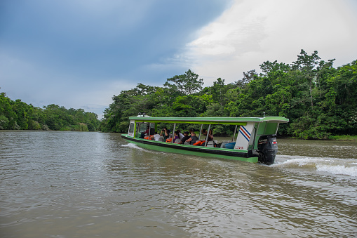 Limon, Costa Rica - September 13, 2022: River transport boat navigating the Tortuguero canal