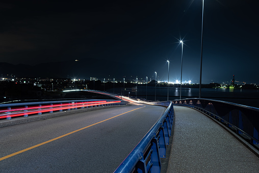 bridge and light trails at night
