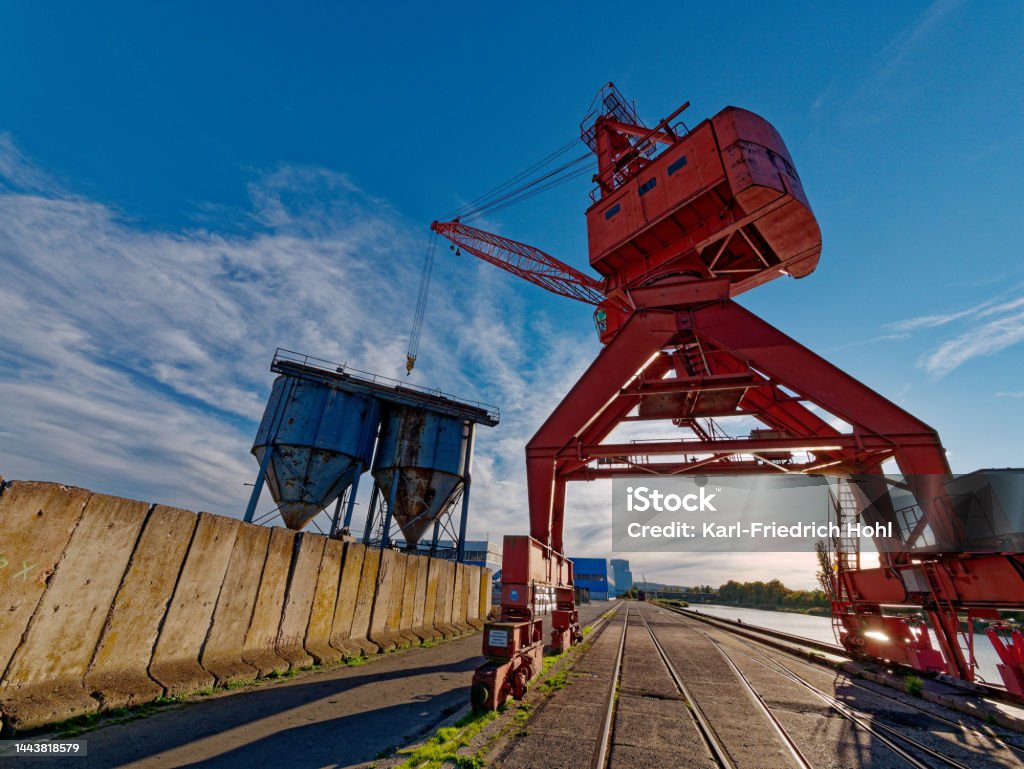 orange harbor crane harbor crane in Fuerth, germany Back Lit Stock Photo