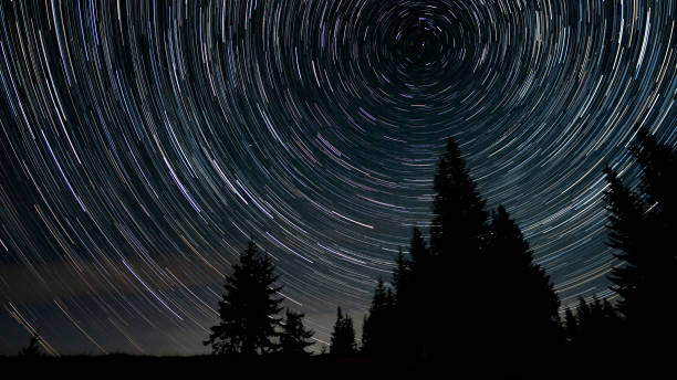 istock Star trails in the night sky 1443818832