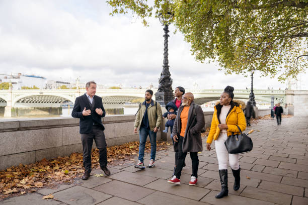 Local historian leading tourists on London walking tour
