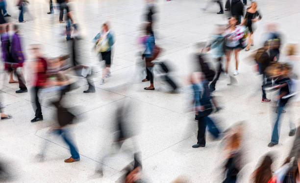 istock People walking in railroad station 1443820828