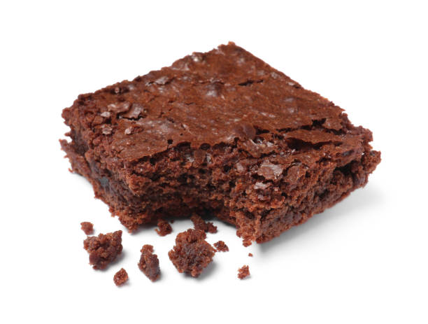 istock Bitten delicious chocolate brownie on white background 1443822635