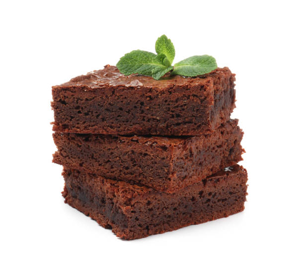 istock Delicious chocolate brownies with fresh mint leaves on white background 1443822817