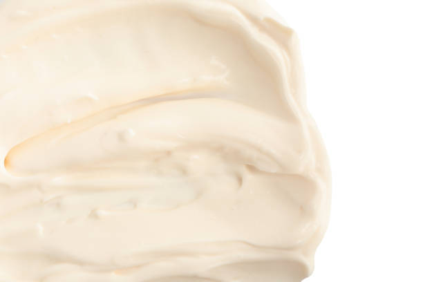 istock Tasty mayonnaise isolated on white, top view 1443823073