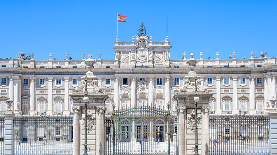 Horse Guards is a historic building in the City of Westminster, London, between Whitehall and Horse Guards Parade. It was built in the mid-18th century. The image shows the building exterior with several tourists, captured during summer season.