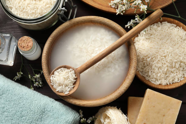 istock Flat lay composition with soaked rice on wooden table 1443825924
