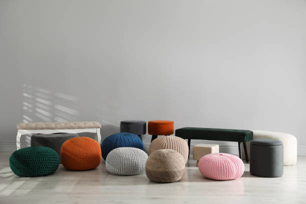 istock Many stylish different poufs and benches indoors. Home design 1443827759