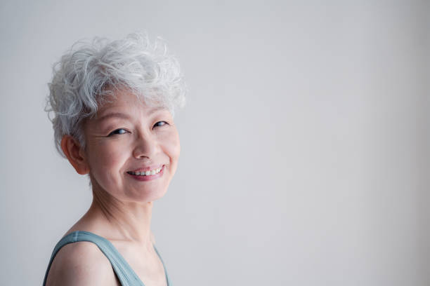 Senior woman who keeps youthfulness stock photo