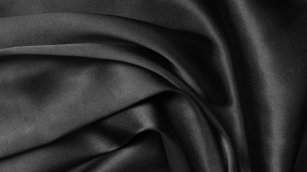 istock Smooth elegant black silk or satin texture can use as abstract background. Luxurious background design 1443830434