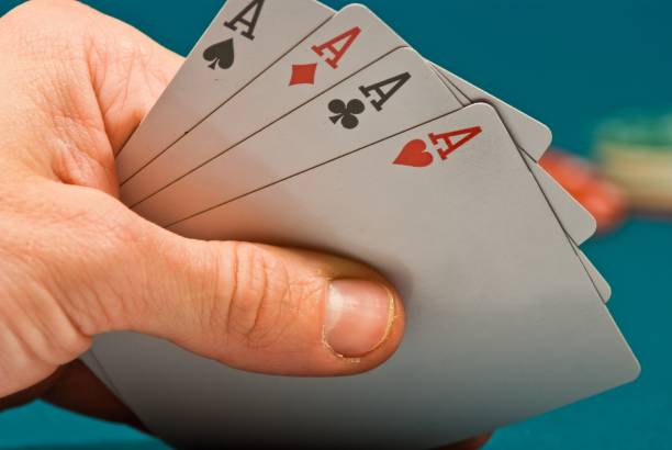 istock playing cards in a people hand 1443834802