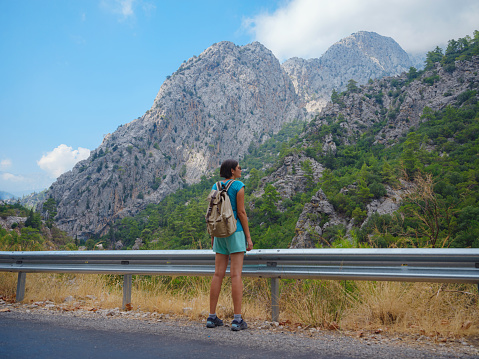 Tourist with backpack hike , Turkey travel, mediterranean area on a warm summer day lycian trail. concept of Zero waste travel, active lifestyle, summer vacation concept.