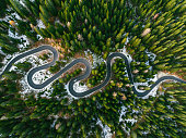 Aerial view of winding road through Dolomites in autumn