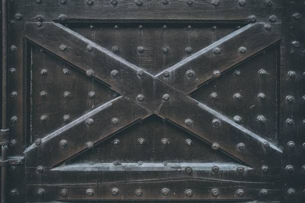 istock Close up Ancient Prison Gate Background in the Dark Tone. 1443836556