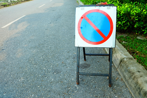 Portable No Parking Sign Standing on the Road.