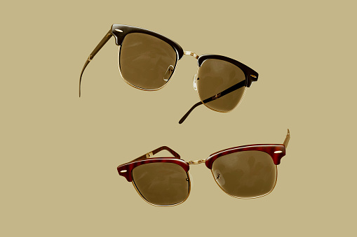 Folding Vintage Sunglasses on yellow background 3d render illustration.