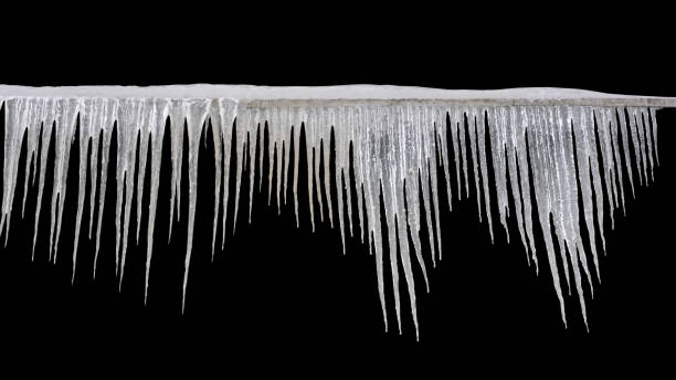 istock Sharp icicles hanging on the edge of the roof. Melting snow forms icicle. 1443842039