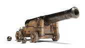 Ancient cannon on wheels with cannonballs isolated on white background with clipping path