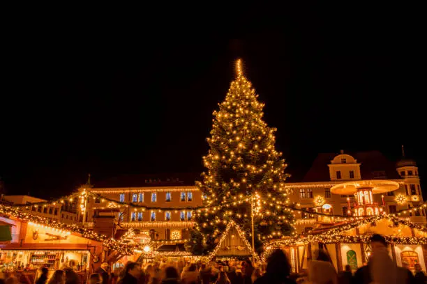 Christmas Market in Germany Augsburg with lights, food stalls, market place and Christmas tree