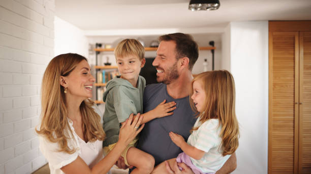 istock Young mom, dad and kids having a good time at home 1443850302