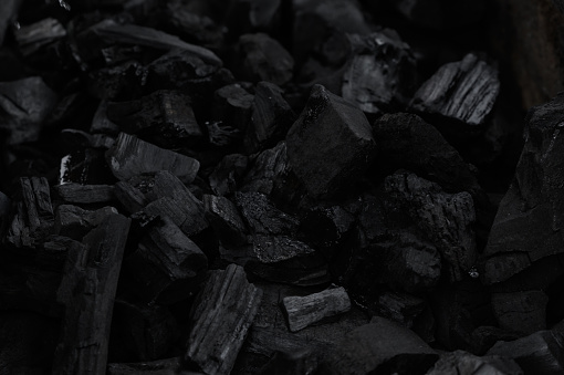 Black charcoal texture background.selective focus
