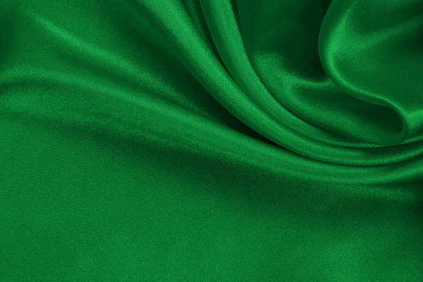 istock Green emerald fabric texture background, detail of silk or linen pattern. 1443850997