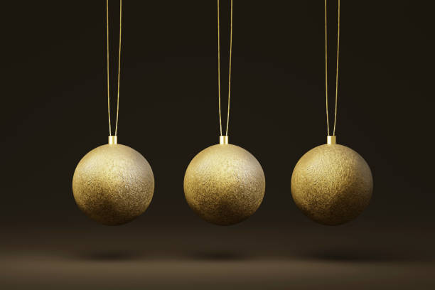 istock Three gold Christmas tree bauble isolated on a dark background. 3d render 1443854641