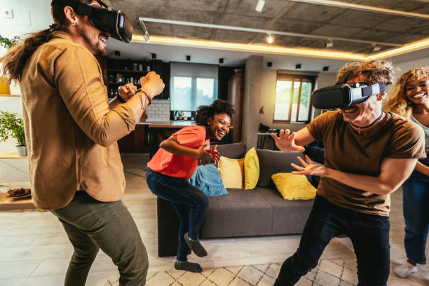 istock Happy friends having fun with VR in home interior 1443854758