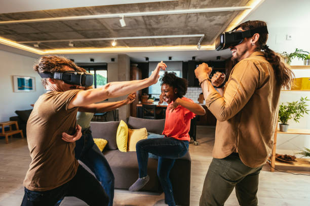 istock Happy friends having fun with VR in home interior 1443854761