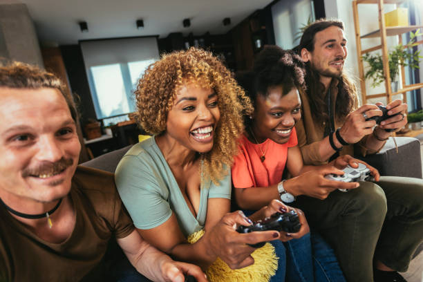 istock Group of friends playing video games. 1443854884