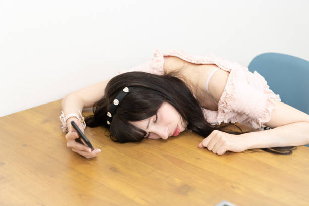 istock A girl looking at the phone crying 1443855091