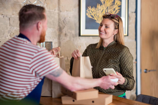 istock Paying for Her Food Order 1443855381