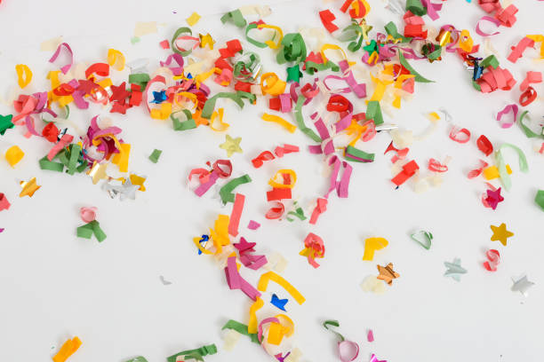 istock multicolored confetti on the white painted wooden floor or table background 1443857148
