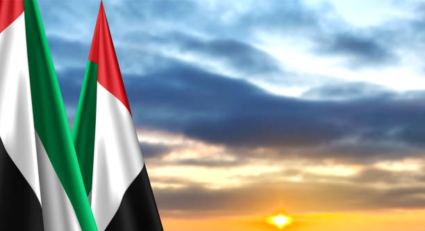 istock UAE flags on background of sunset or sunrise. Concept for National Holidays 1443857995
