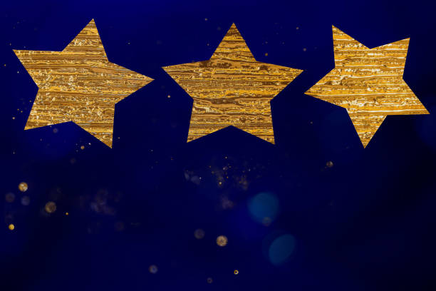 istock golden angel shape and particles on blurry blue background 1443859643