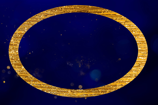 elegant golden coval shape frame copy  space for your own text, background like blue night sky