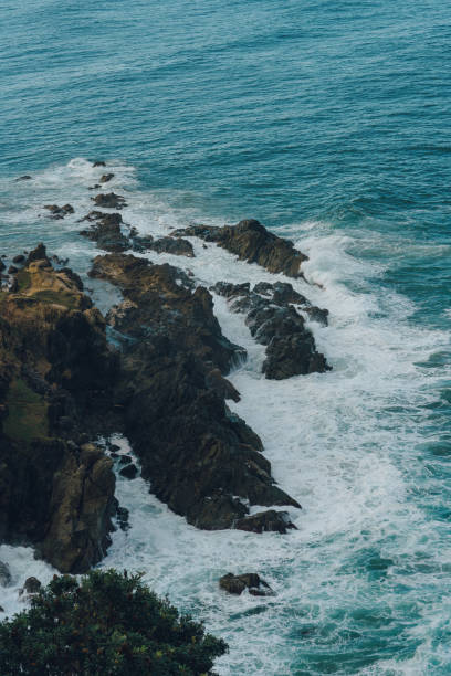 Seascape waves smashing rocks aerial view stock photo