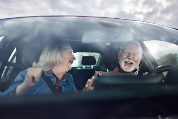 istock Cheerful senior couple going on a road trip by car. 1443864108