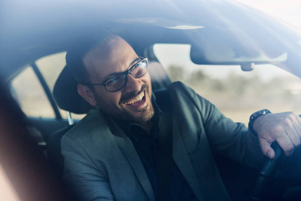 istock Happy businessman going on a trip by car. 1443864435