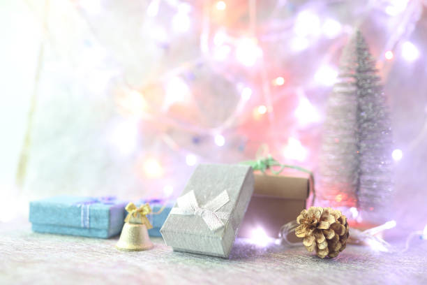 istock Gift boxes and Christmas bright lights and golden bell 1443865568