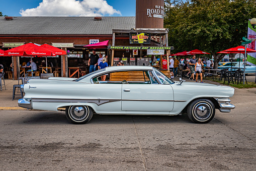 Des Moines, IA - July 03, 2022: High perspective side view of a 1960 Dodge Dart Phoenix 2 Door Hardtop at a local car show.