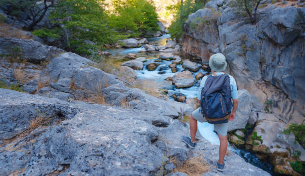 Turkey travel, mediterranean area on a warm summer day, man hike in Yazili Canyon National Park