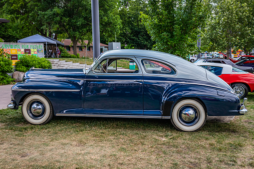 Des Moines, IA - July 03, 2022: High perspective side view of a 1941 Oldsmobile Series 60 Club Coupe at a local car show.