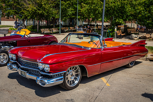 Des Moines, IA - July 03, 2022: High perspective front corner view of a 1959 Cadillac Series 62 Convertible at a local car show.