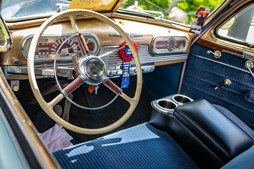 Des Moines, IA - July 03, 2022: High perspective detail interior view of a 1941 Oldsmobile Series 60 Club Coupe at a local car show.