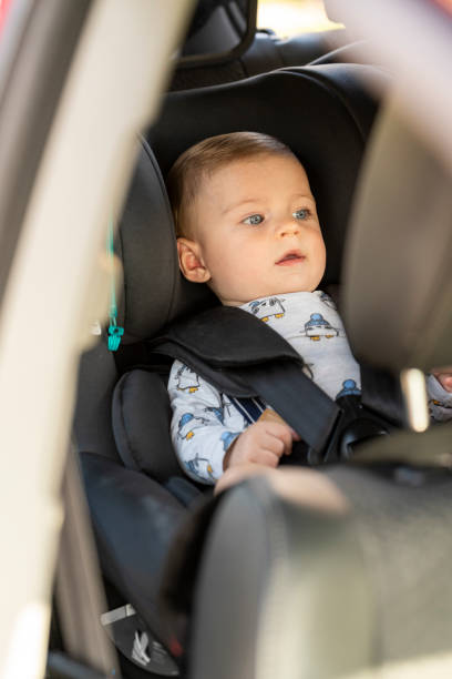 istock Baby in the car seat with security belt 1443868744